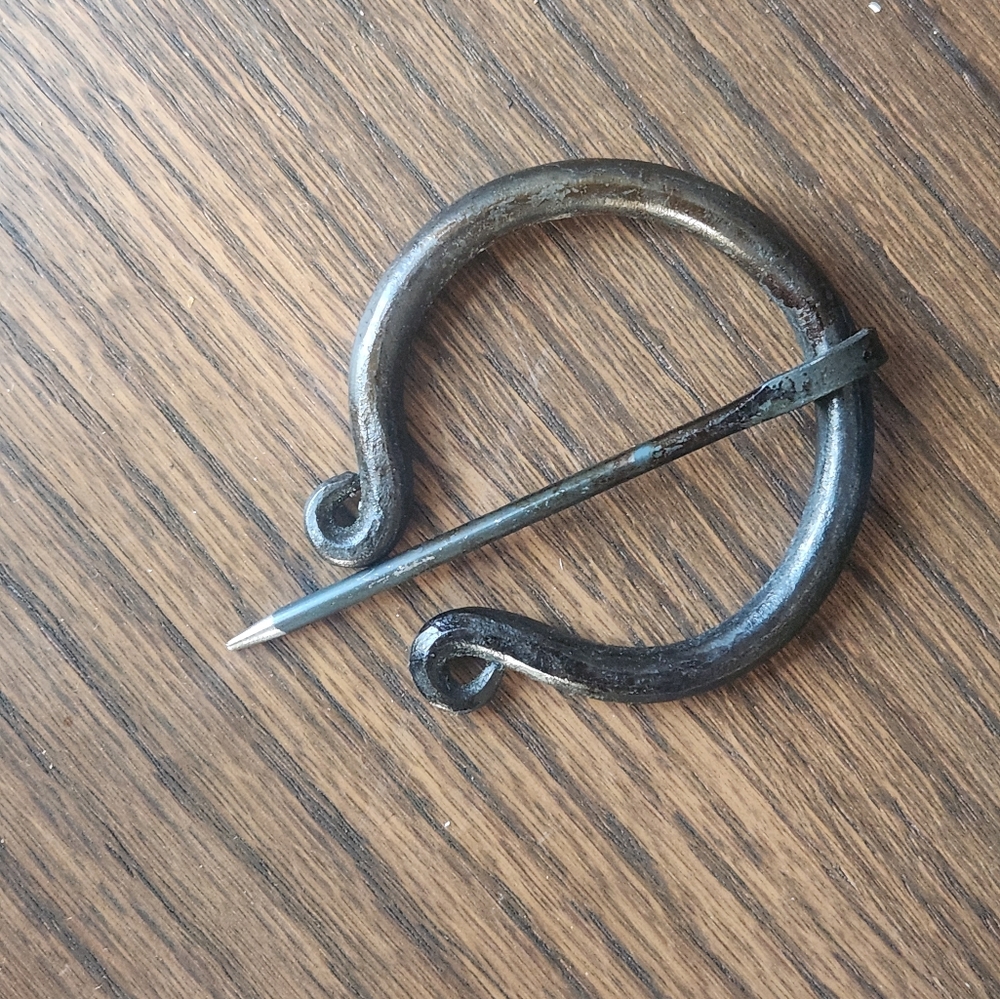Hand forged iron clasp for cape